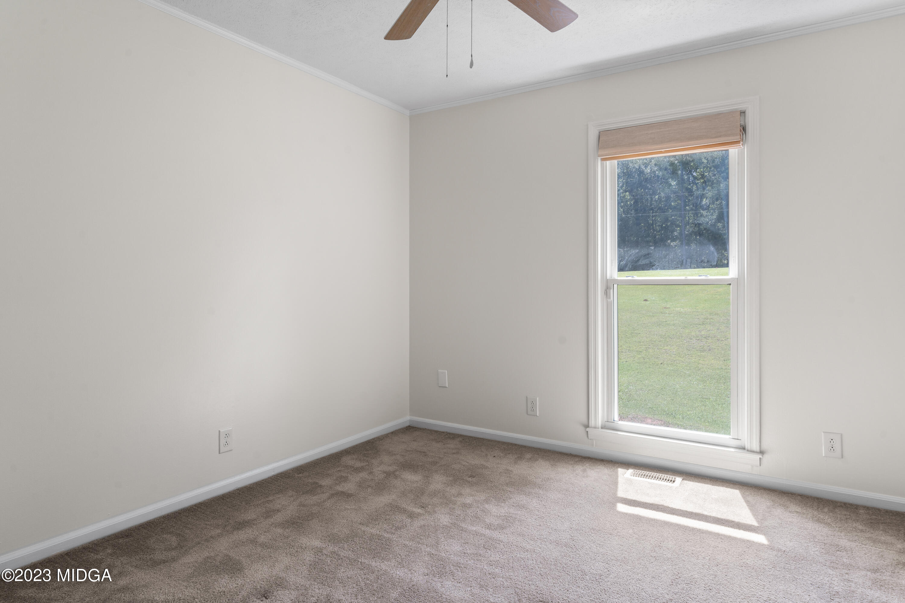 421 Plantation Road Gray, GA 31032 - Photo 17 of 31 an empty room with a window