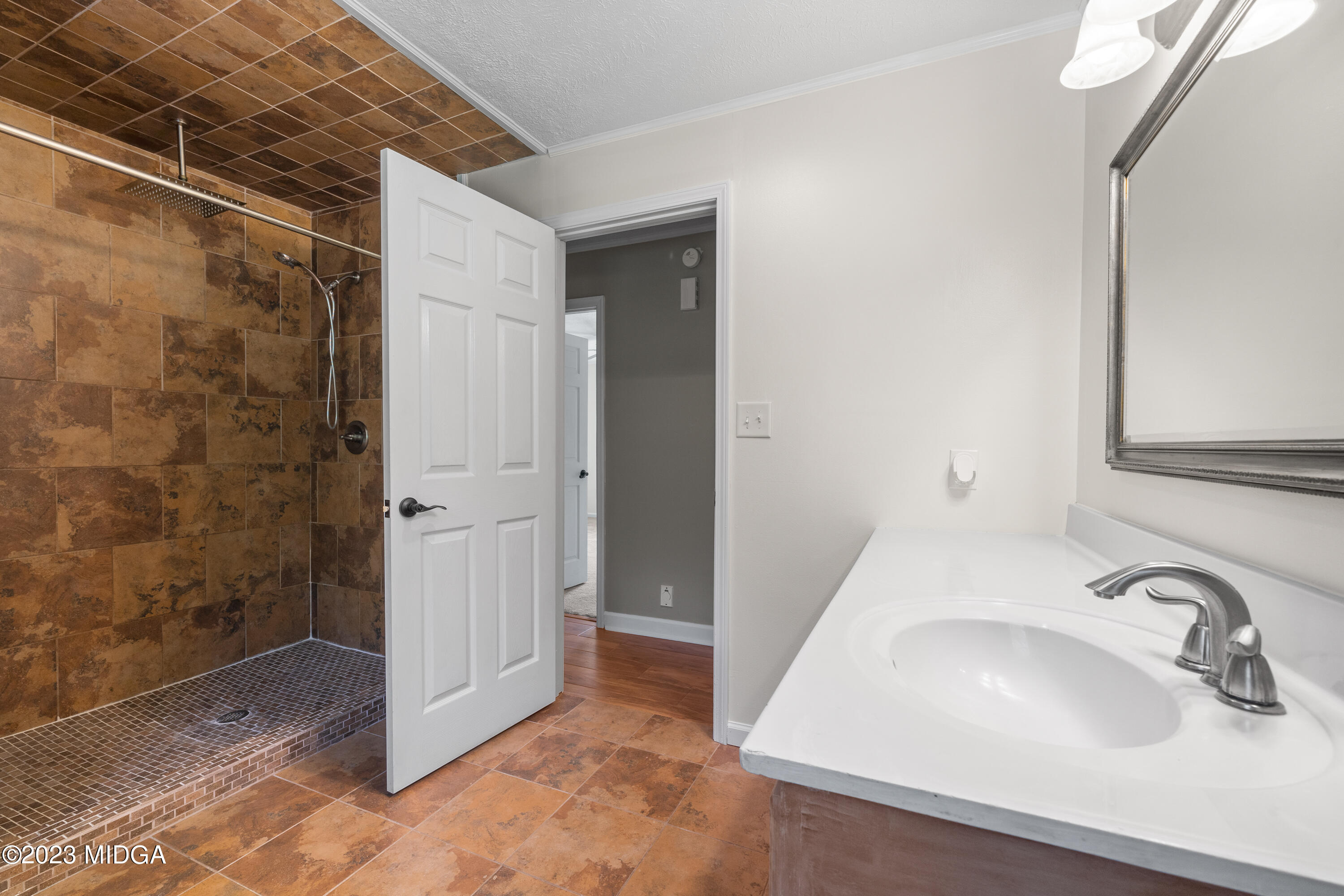 421 Plantation Road Gray, GA 31032 - Photo 20 of 31 a bathroom with a sink and a shower