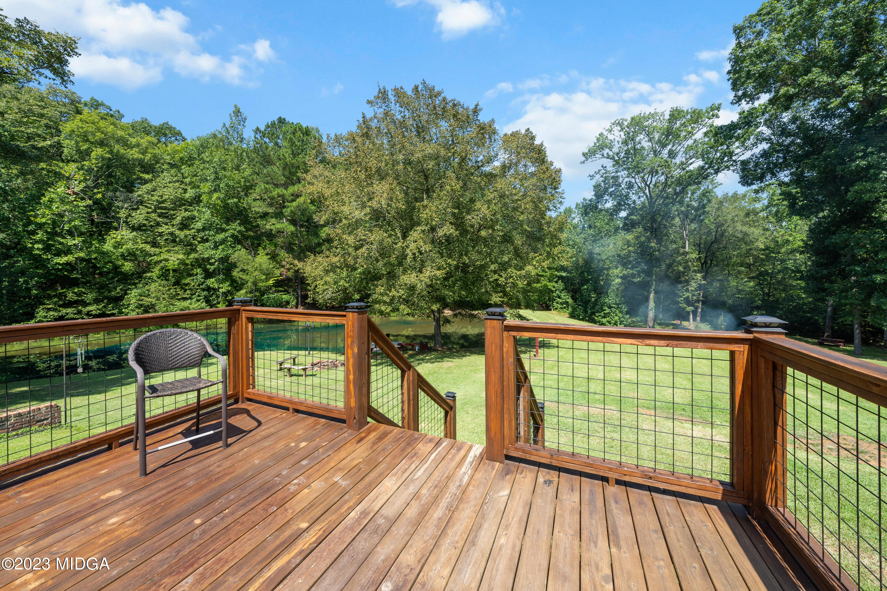421 Plantation Road Gray, GA 31032 - Photo 25 of 31 a view of balcony with wooden floor and seating space