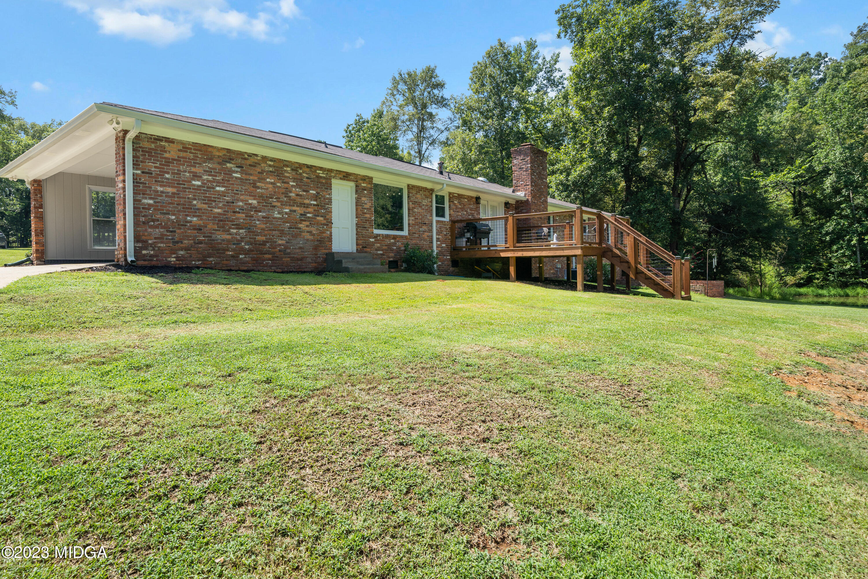 421 Plantation Road Gray, GA 31032 - Photo 29 of 31 a front view of a house with garden