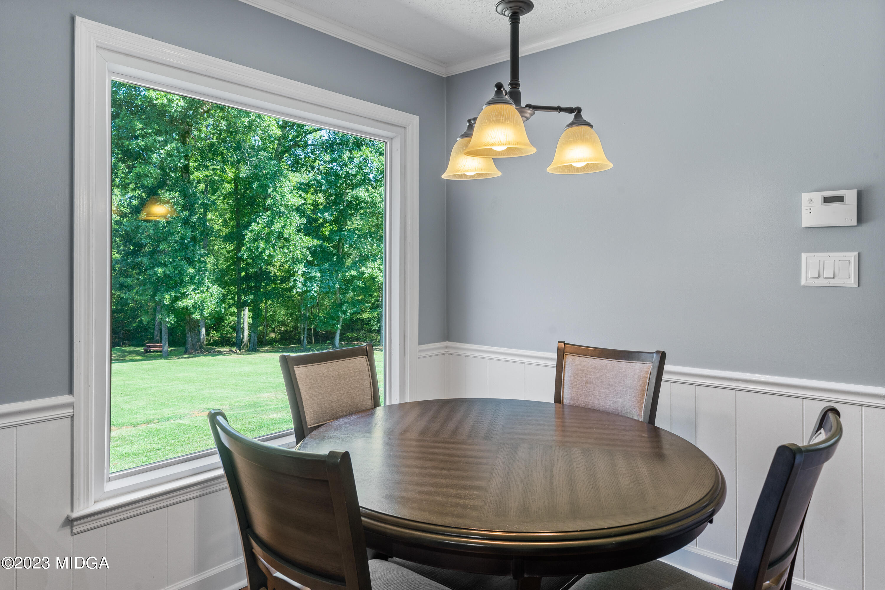 421 Plantation Road Gray, GA 31032 - Photo 6 of 31 a view of table and chair in living room