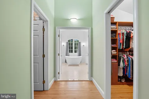 a view of a kitchen with furniture and a ceiling fan