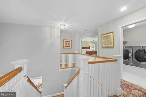 a bathroom with a granite countertop toilet a sink and a mirror