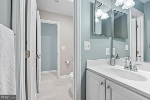 a bathroom with a toilet a sink and a shower