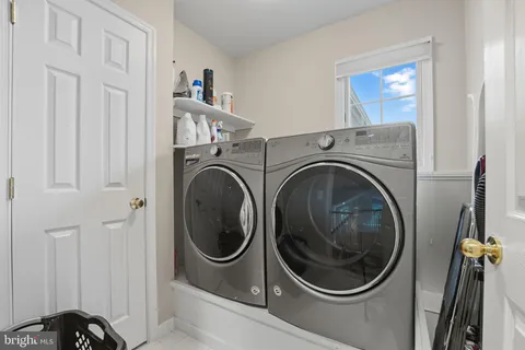 a view of a two chairs and table in the balcony