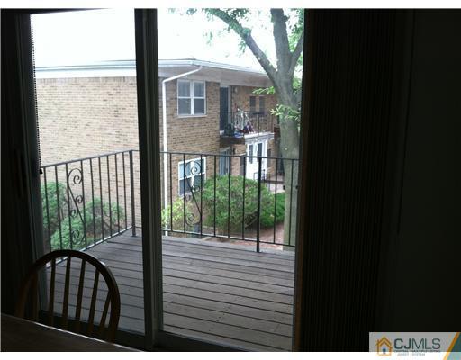 199 Evergreen Road, Unit 13B Edison, NJ 08837 - Photo 15 of 16 a view of a house with backyard from deck
