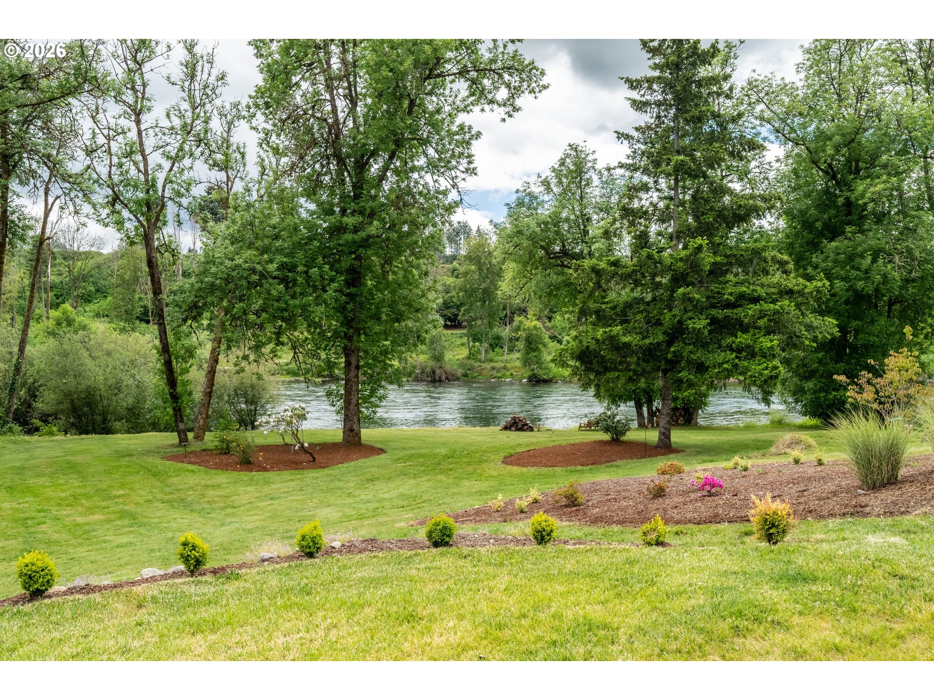 45542 South Gate Creek Road Vida, OR 97488 - Photo 41 of 46 a view of a field with a tree