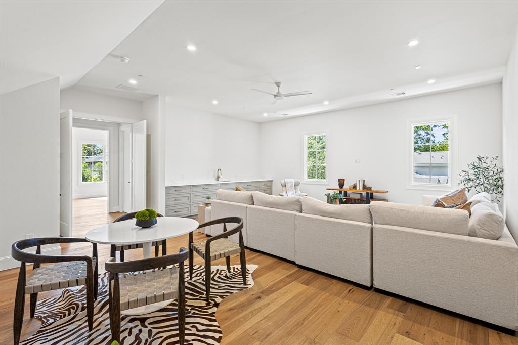 5925 Williamstown Road Dallas, TX 75230 - Photo 18 of 39 Living room with light wood-style flooring, recessed lighting, and ceiling fan