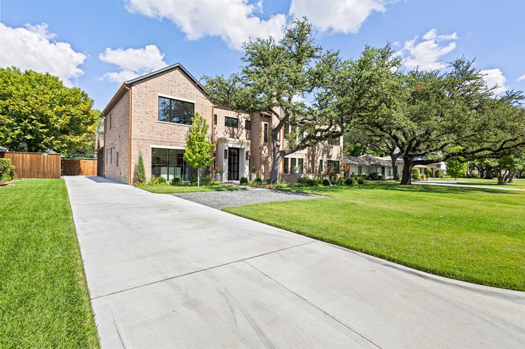 5925 Williamstown Road Dallas, TX 75230 - Photo 2 of 39 View of front facade with brick siding and driveway