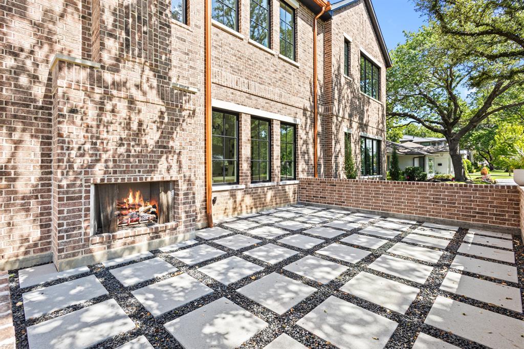 5925 Williamstown Road Dallas, TX 75230 - Photo 3 of 39 View of patio / terrace with an outdoor brick fireplace