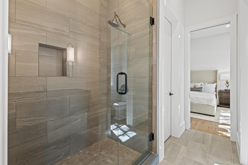5925 Williamstown Road Dallas, TX 75230 - Photo 34 of 39 Ensuite bathroom with a stall shower and tile patterned flooring