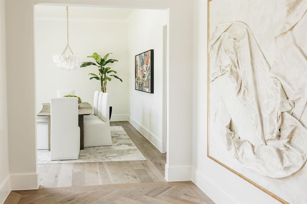 5925 Williamstown Road Dallas, TX 75230 - Photo 5 of 39 Dining area with parquet flooring, ornamental molding, and a chandelier