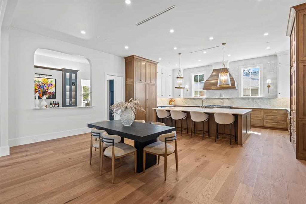5925 Williamstown Road Dallas, TX 75230 - Photo 9 of 39 Dining space with light wood finished floors, recessed lighting, and arched walkways