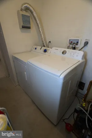 a refrigerator freezer sitting inside of a kitchen