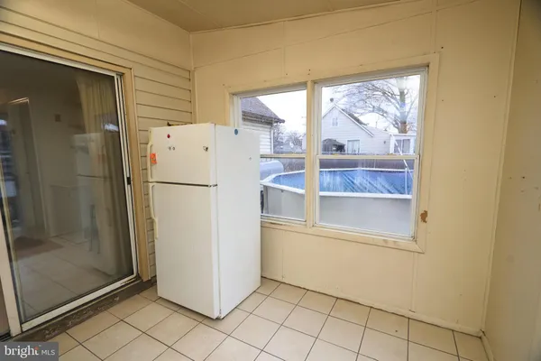 a white toilet sitting next to a shower curtain