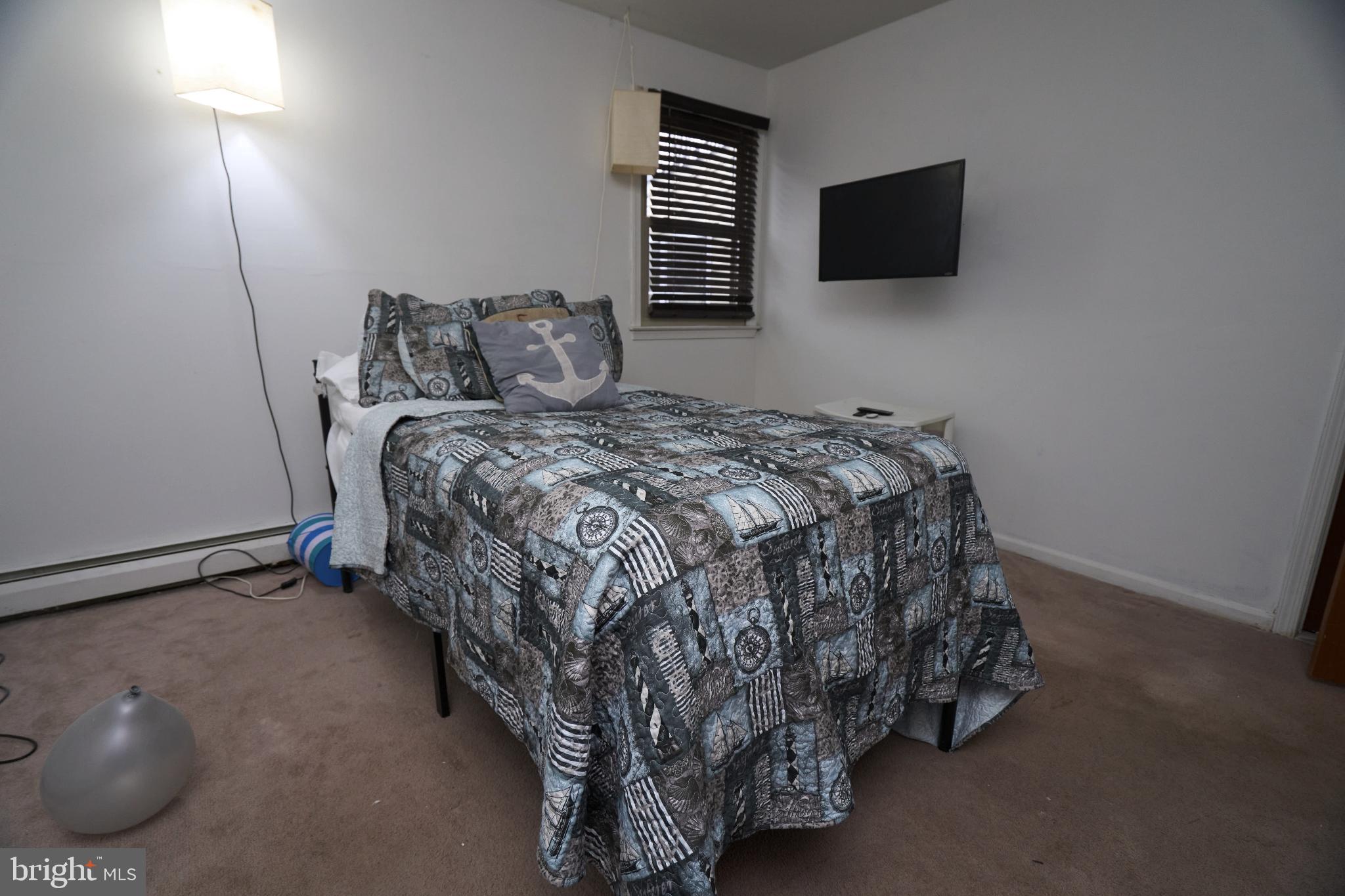 2113 Pennsylvania Avenue Croydon, PA 19021 - Photo 15 of 36 a bedroom with a bed and a television