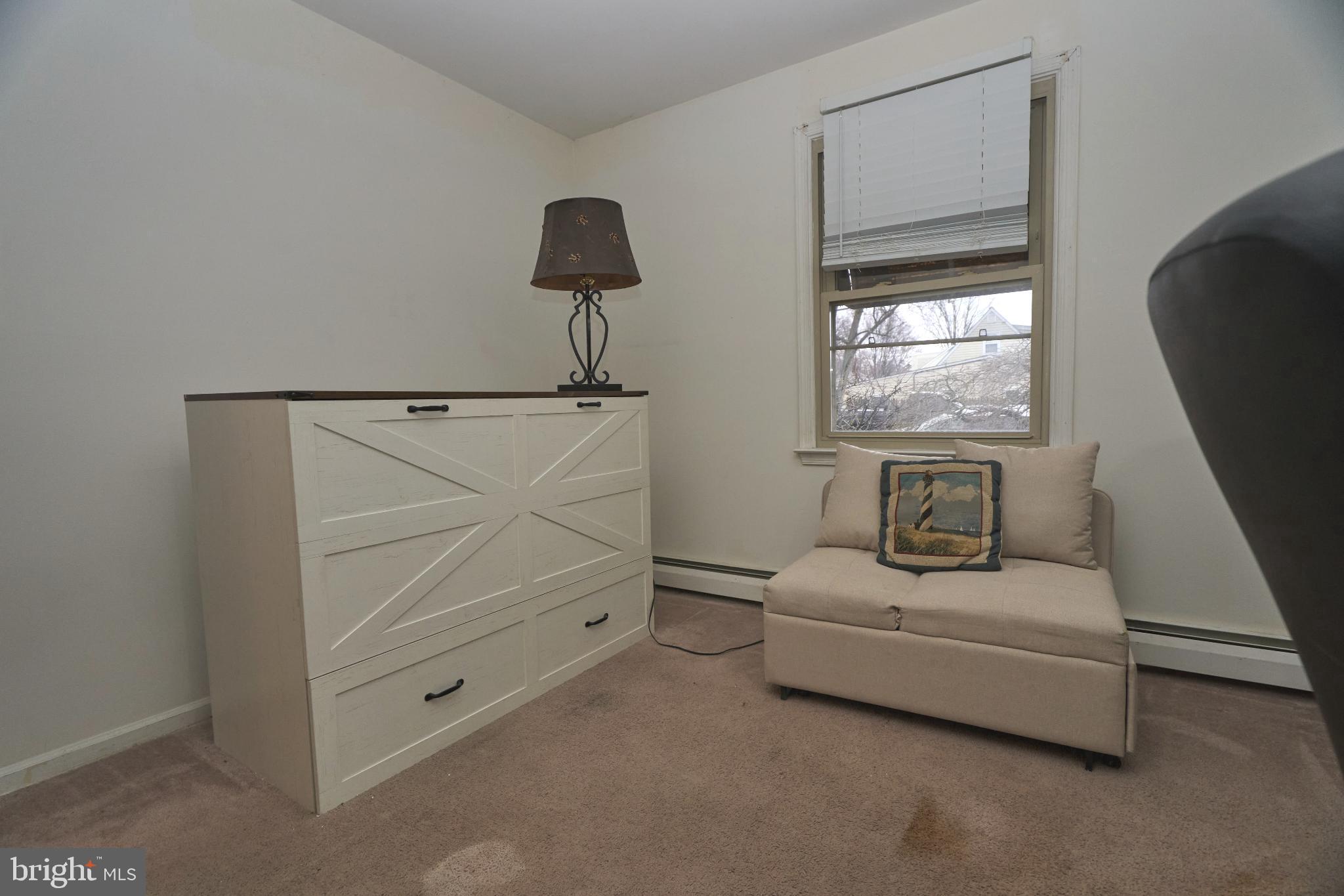 2113 Pennsylvania Avenue Croydon, PA 19021 - Photo 20 of 36 a living room with furniture and a window