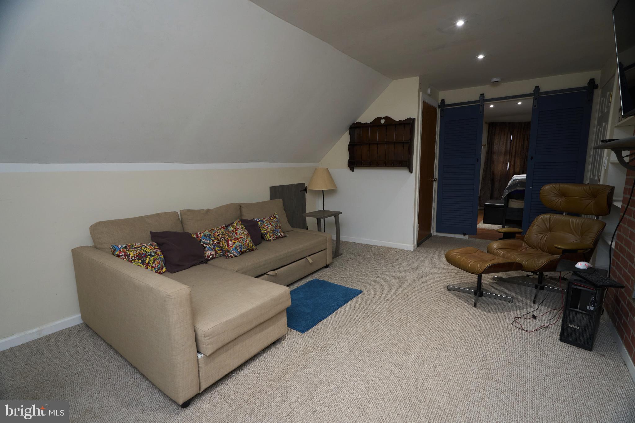 2113 Pennsylvania Avenue Croydon, PA 19021 - Photo 23 of 36 a living room with furniture and a flat screen tv