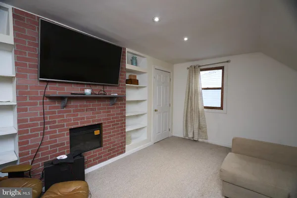 a front view of house with yard and seating space