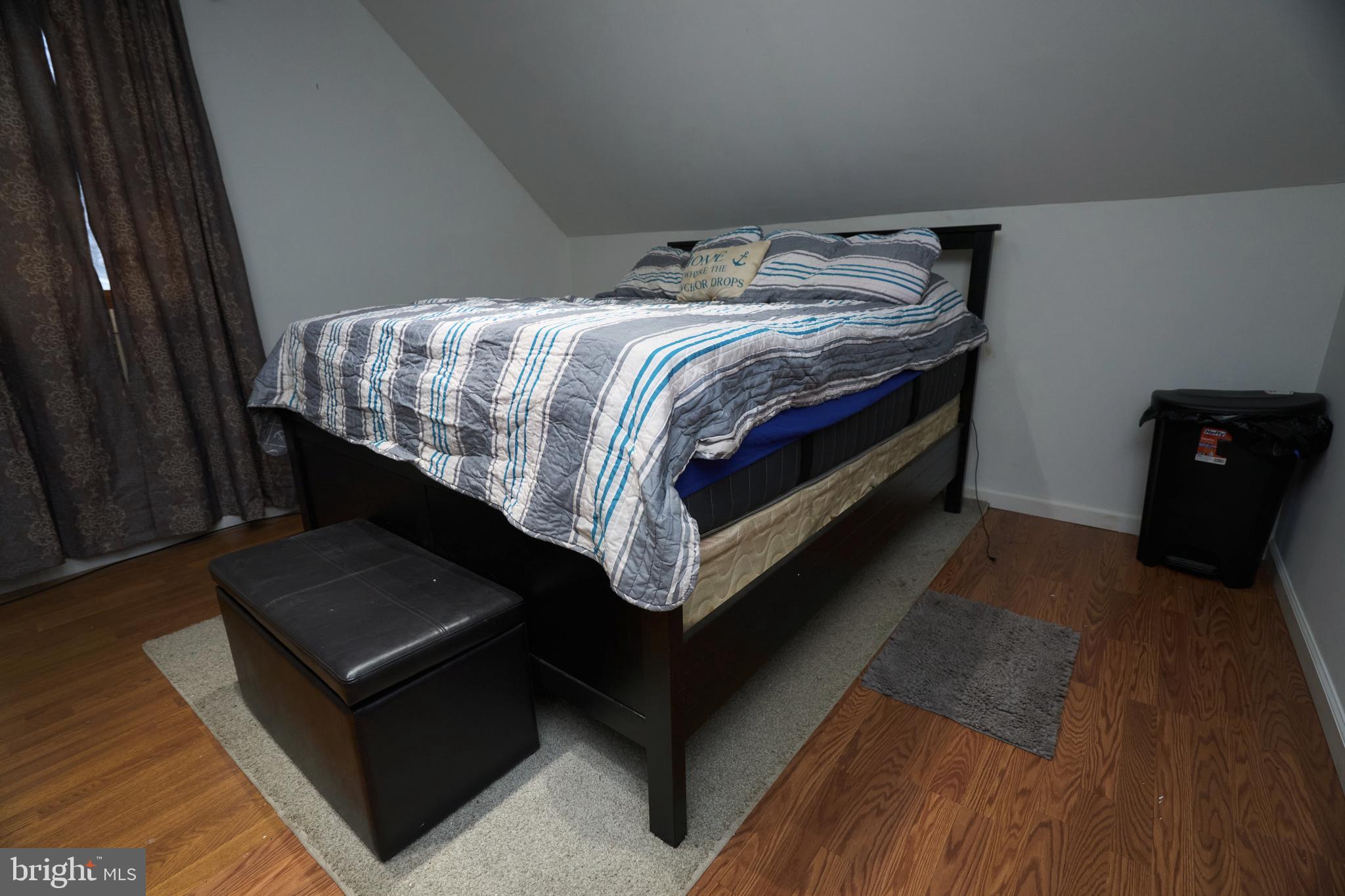 2113 Pennsylvania Avenue Croydon, PA 19021 - Photo 26 of 36 a bed sitting in a bedroom next to a window