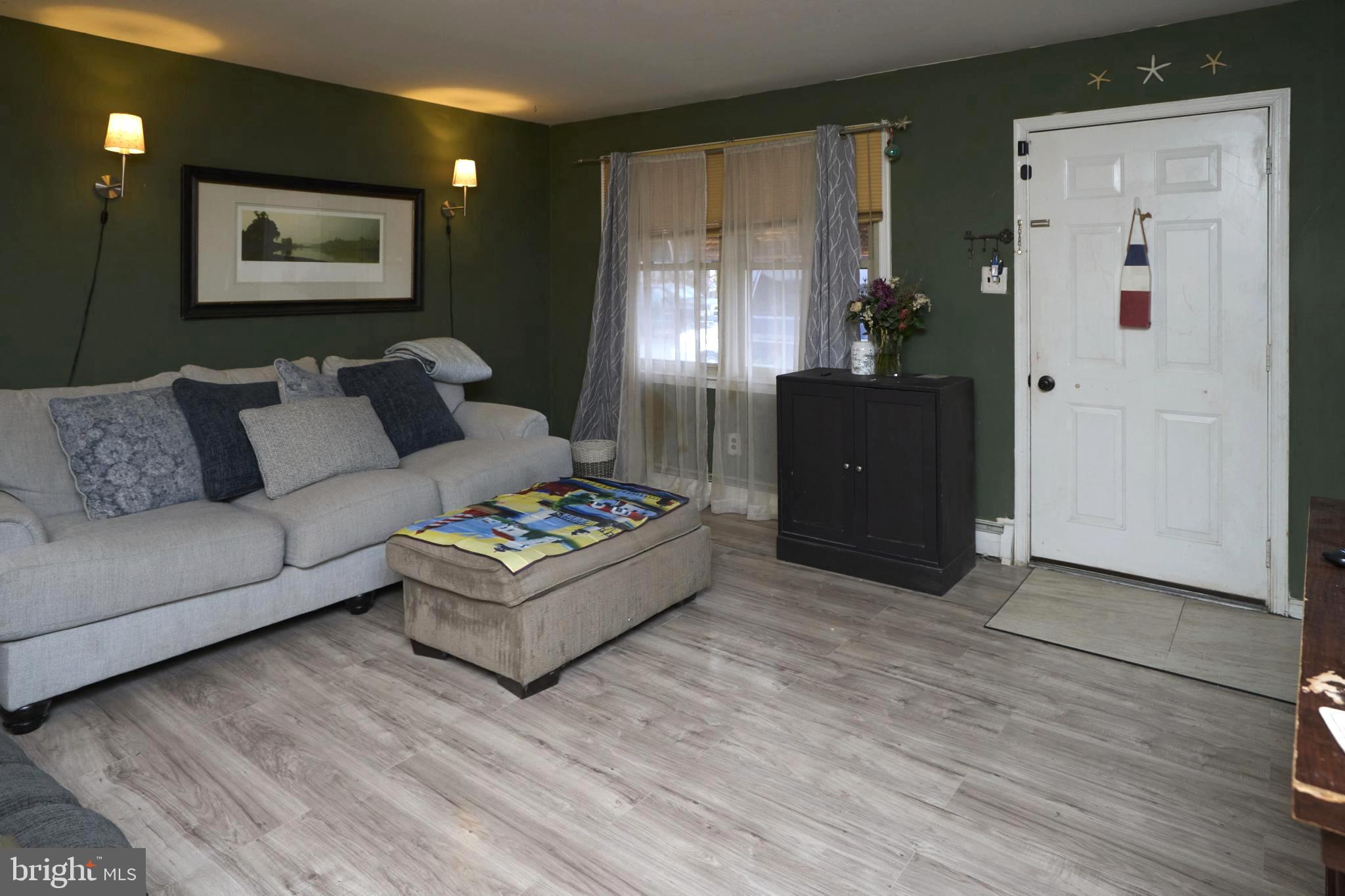 2113 Pennsylvania Avenue Croydon, PA 19021 - Photo 3 of 36 a living room with furniture and a flat screen tv