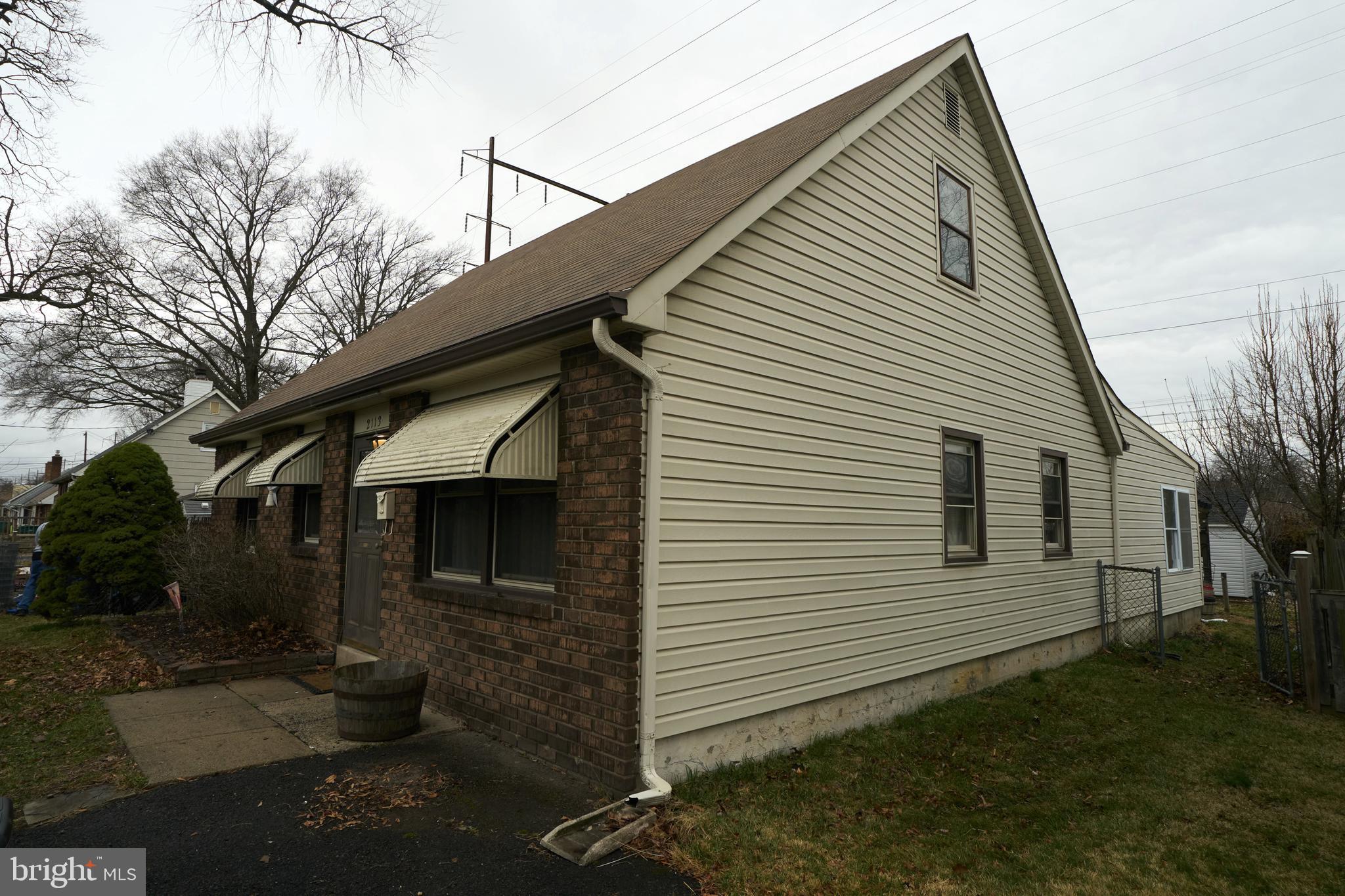 2113 Pennsylvania Avenue Croydon, PA 19021 - Photo 35 of 36 a view of a white house next to a yard