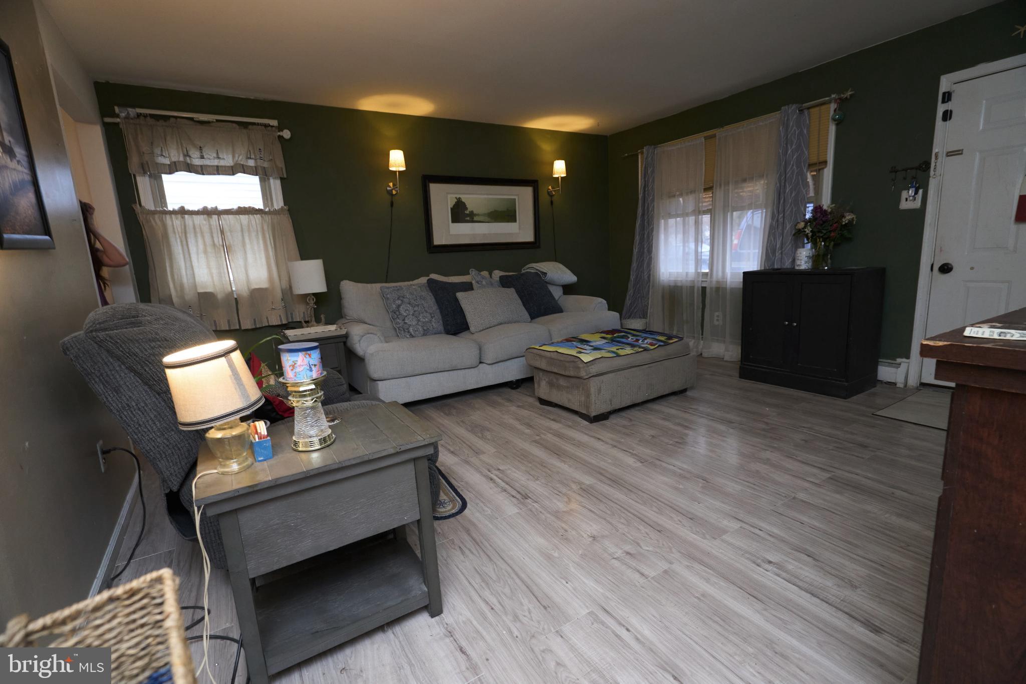 2113 Pennsylvania Avenue Croydon, PA 19021 - Photo 4 of 36 a living room with furniture and a flat screen tv