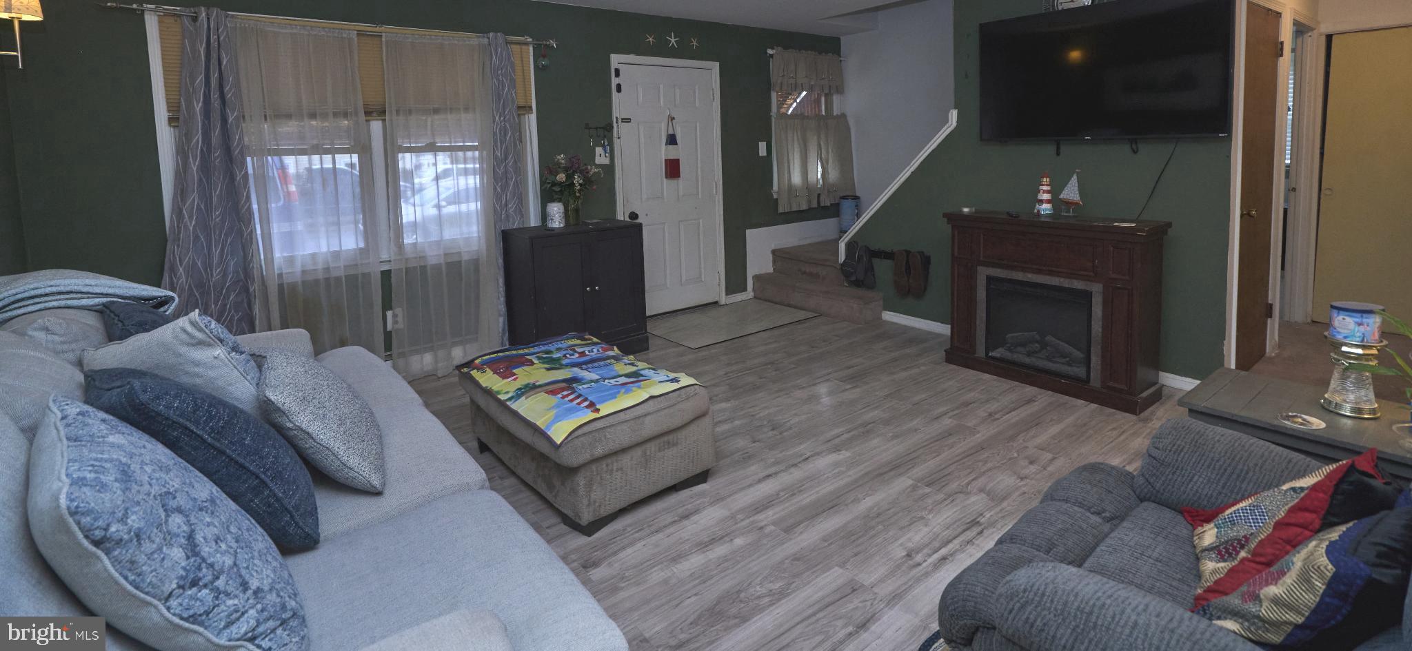 2113 Pennsylvania Avenue Croydon, PA 19021 - Photo 5 of 36 a living room with furniture and a fireplace