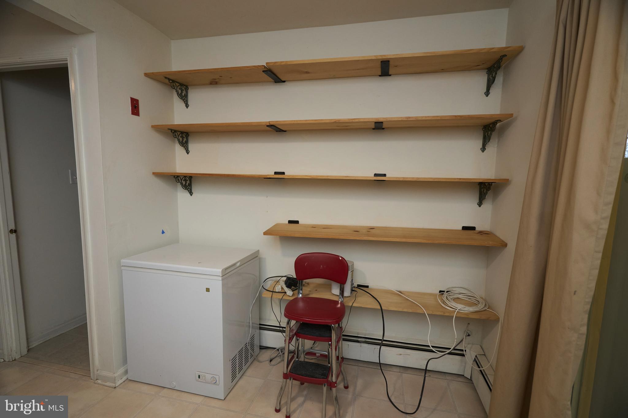 2113 Pennsylvania Avenue Croydon, PA 19021 - Photo 9 of 36 a view of storage and utility room with racks on the wall