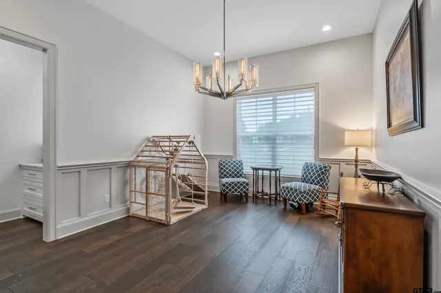 a view of livingroom with furniture wooden floor and windows