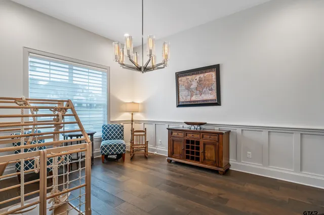 a view of a livingroom with furniture and chandelier