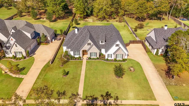 swimming pool view with a garden