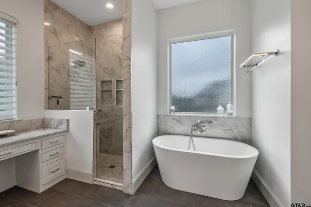 a bathroom with a bathtub and a sink
