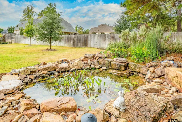 a view of a lake with a lawn chairs
