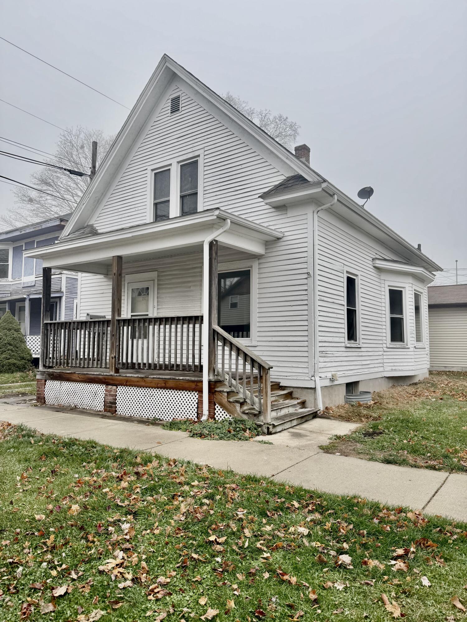 809 Chicago Street La Porte, IN 46350 - Photo 1 of 11 a front view of a house with a yard