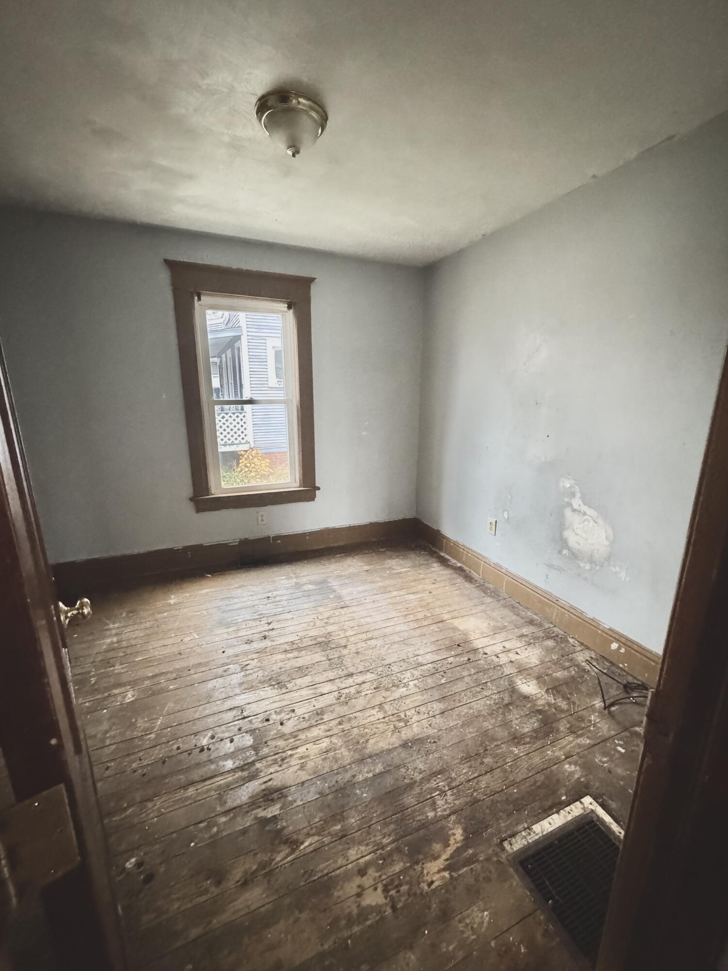 809 Chicago Street La Porte, IN 46350 - Photo 7 of 11 a view of an empty room with a window