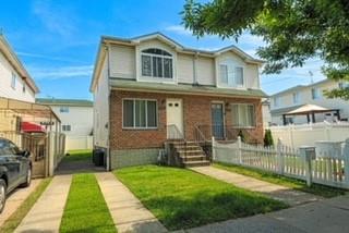 6652 Ave. M Brooklyn, NY 11234 - Photo 1 of 18 a front view of a house with a yard
