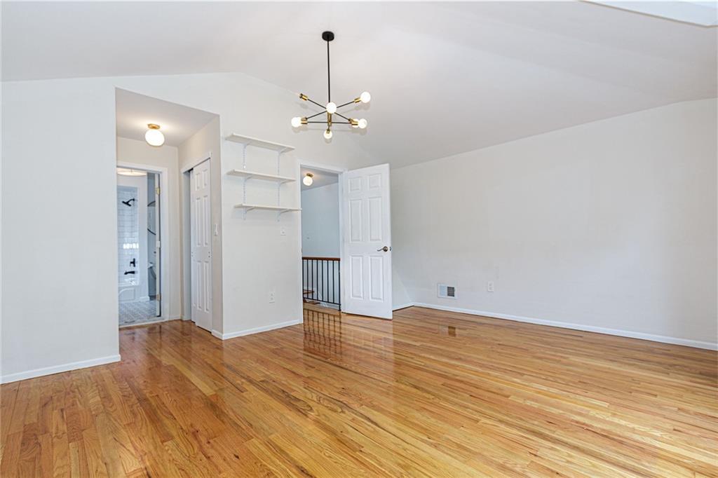 6652 Ave. M Brooklyn, NY 11234 - Photo 13 of 18 a view of empty room with wooden floor