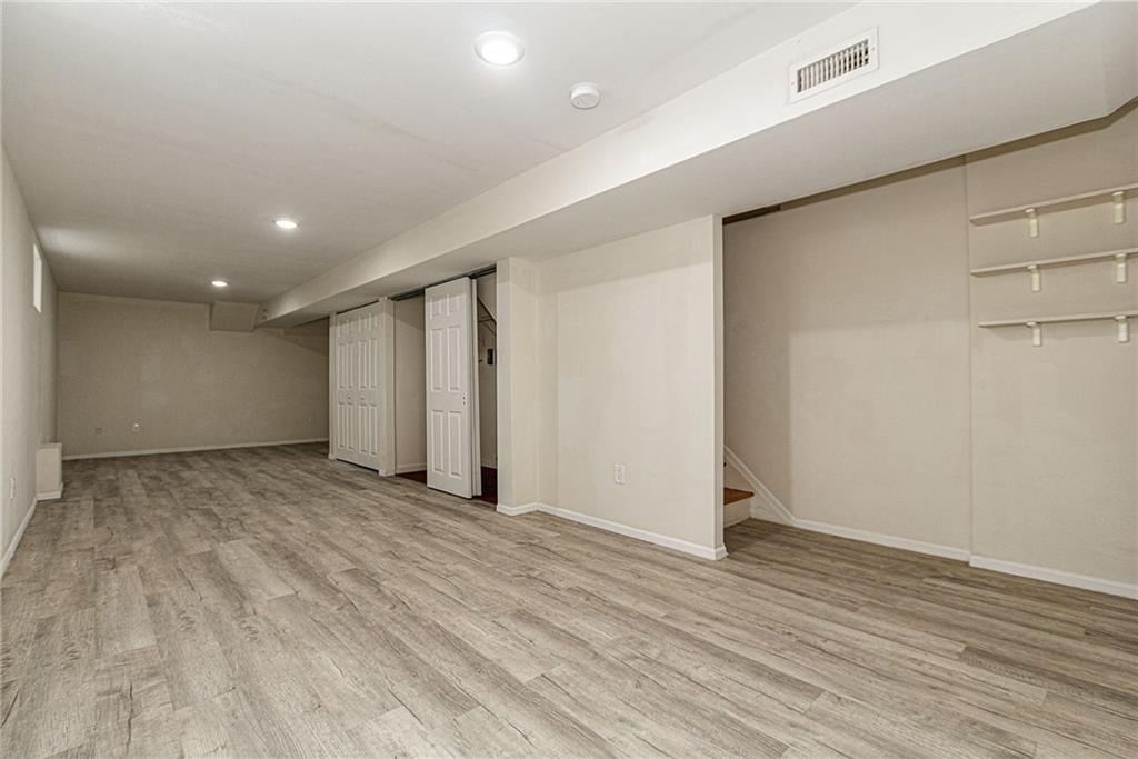 6652 Ave. M Brooklyn, NY 11234 - Photo 15 of 18 wooden floor in an empty room with a window