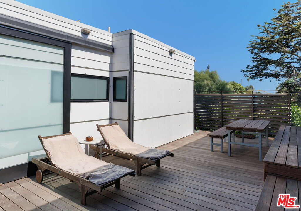 341 5th Avenue Venice, CA 90291 - Photo 15 of 24 a terrace with outdoor seating and wooden floor