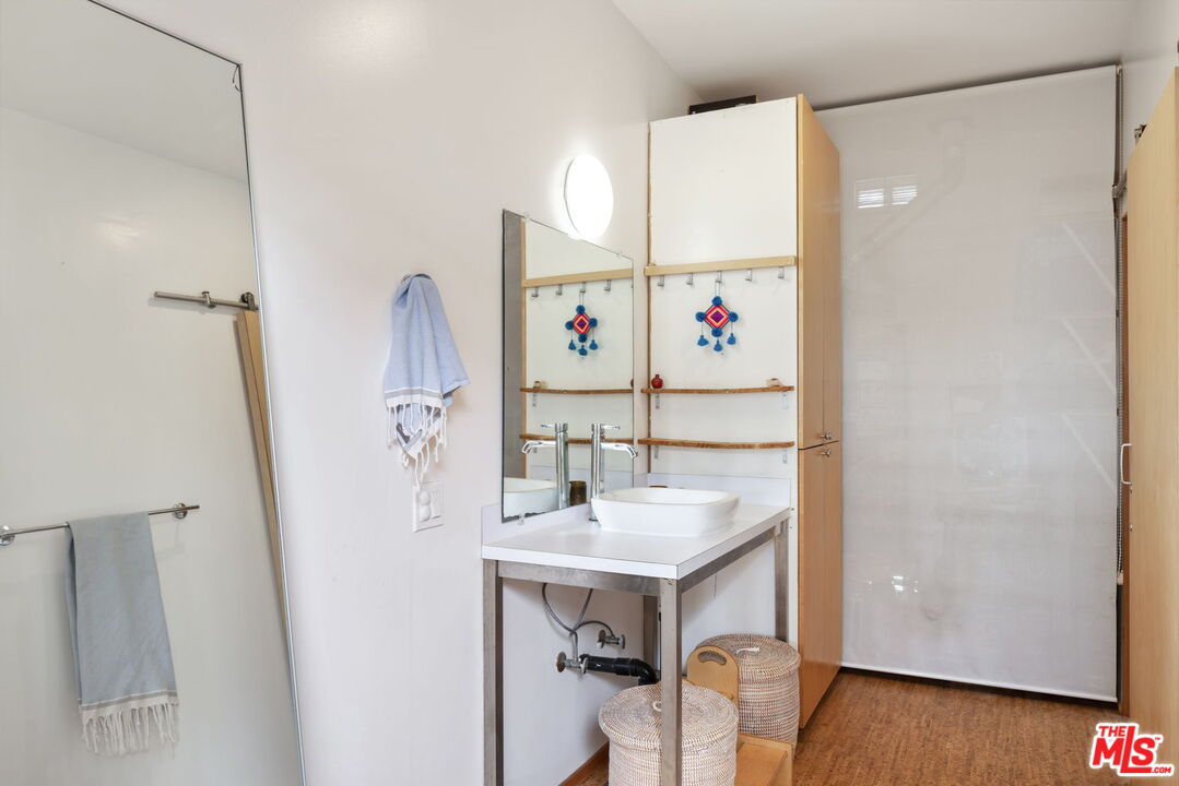 341 5th Avenue Venice, CA 90291 - Photo 18 of 24 a white cabinet sitting next to a white sink and a refrigerator