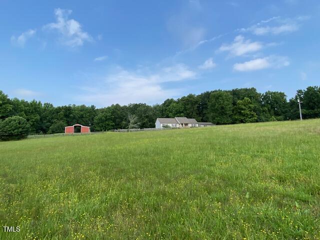 1167 John D Winstead Road Roxboro, NC 27574 - Photo 33 of 55 a front view of a house with a yard
