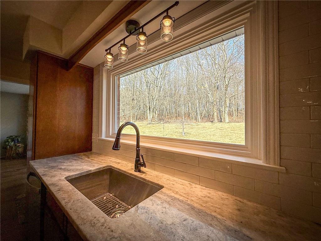 163 Crisswell Road Butler, PA 16002 - Photo 15 of 46 a kitchen with granite countertop a sink and a window