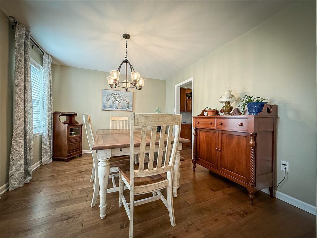 163 Crisswell Road Butler, PA 16002 - Photo 16 of 46 a view of a dining room with furniture window and wooden floor