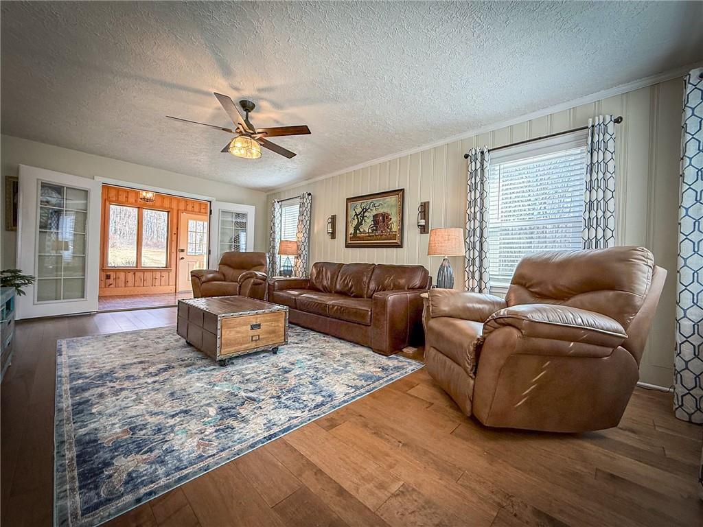 163 Crisswell Road Butler, PA 16002 - Photo 20 of 46 a living room with furniture ceiling fan and a rug