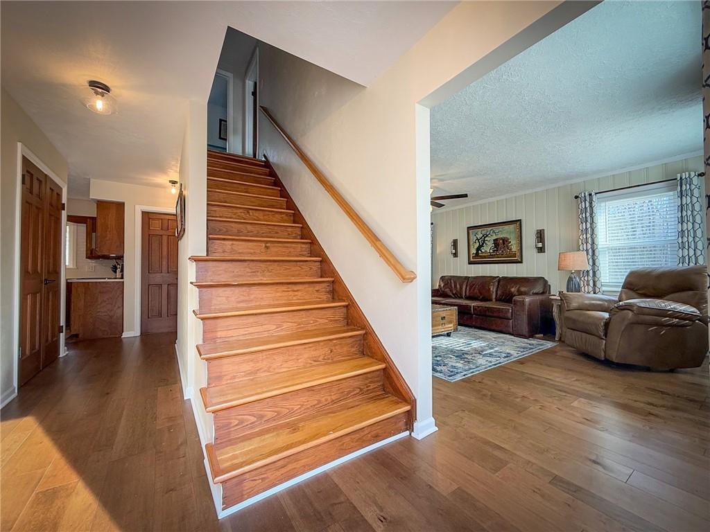 163 Crisswell Road Butler, PA 16002 - Photo 23 of 46 a living room with furniture and stairs