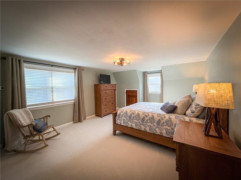 163 Crisswell Road Butler, PA 16002 - Photo 25 of 46 a bedroom with a bed and chair next to a window