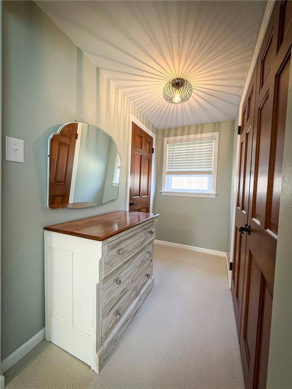 163 Crisswell Road Butler, PA 16002 - Photo 27 of 46 a room with a chandelier and dresser