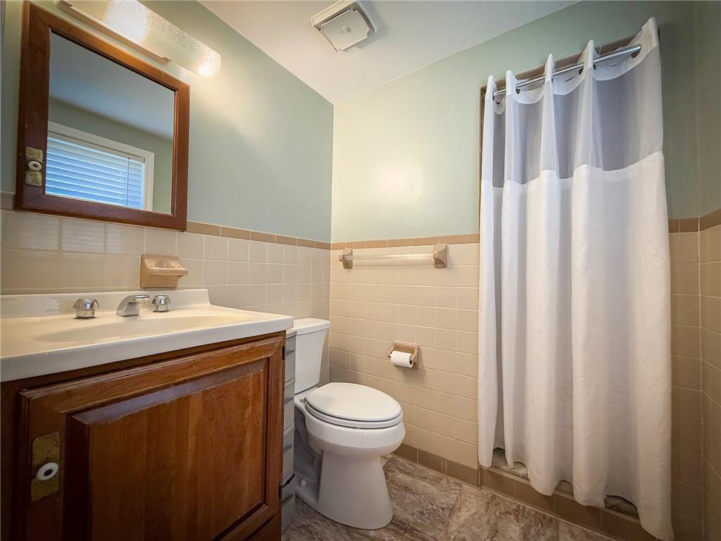163 Crisswell Road Butler, PA 16002 - Photo 36 of 46 a bathroom with a sink a toilet and shower