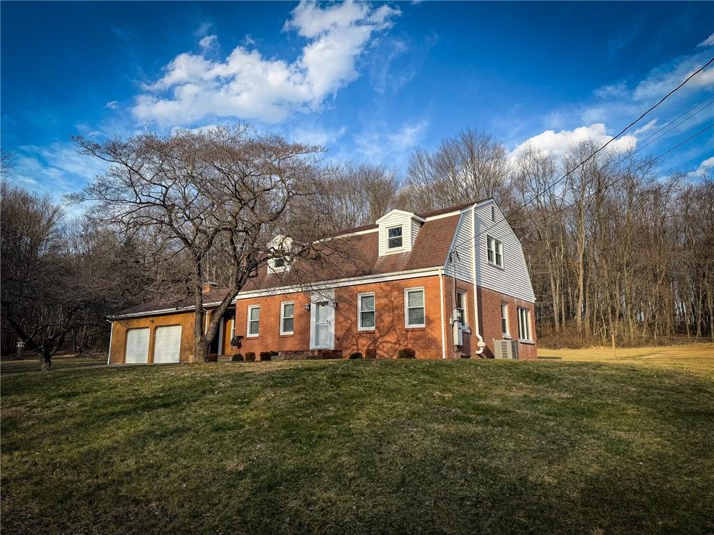 163 Crisswell Road Butler, PA 16002 - Photo 40 of 46 a front view of a house with a yard